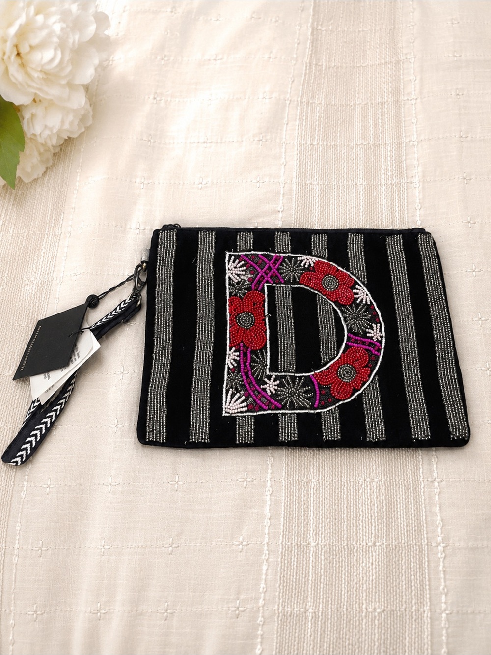 Embroidered 'D' Black Striped Wristlet Clutch with Red & Purple Accents
